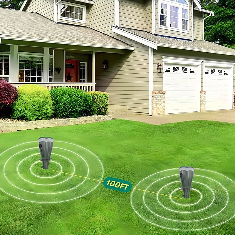 Two repellers standing in a front lawn a hundred feet apart, each ringed by its own circular coverage area